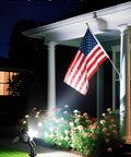 Garden with flag lit by Robot Inspired Solar Spotlight Outdoor Waterproof With Auto On Off And Dual Brightness Modes for Pathway