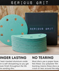 Pro Grade Heavy Duty 5 Inch 9 Hole Sanding Discs Set With 80 120 150 180 220 Grits, Ten Of Each, shown stacked near packaging.