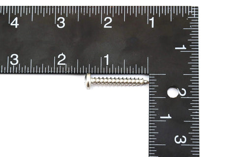 Close-up of marine-grade stainless steel truss-head screw, 1-1/4 in length, shown beside ruler for scale