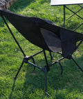 Back view of Grab-And-Go Lightweight Camping Chair For Adults Folding Portable Chair with square base on grass