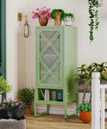 Heavy Duty Outdoor Storage Cabinet In Sage Green With Waterproof Rust Resistant Steel Construction on porch with plants