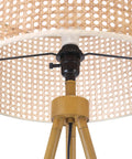 Close-up of rattan shade and faux wood tripod base of 60 Inch Floor Lamp With Faux Wood Tripod Base And Rattan Shade On Off Rotary Switch