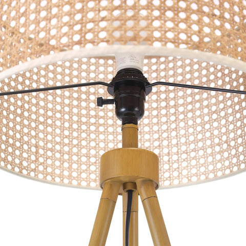 Close-up of rattan shade and faux wood tripod base of 60 Inch Floor Lamp With Faux Wood Tripod Base And Rattan Shade On Off Rotary Switch