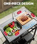 Top view of 35-Inch Outdoor Grill Cart With Stainless Steel Sink, Rolling BBQ Prep Table With Faucet, Ample Prep Space, Storage Shelves And Lockable Wheels For Patio, Backyard And Outdoor Cooking, Silver And Black, showing integrated sink with vegetables and cutting board with meat.
