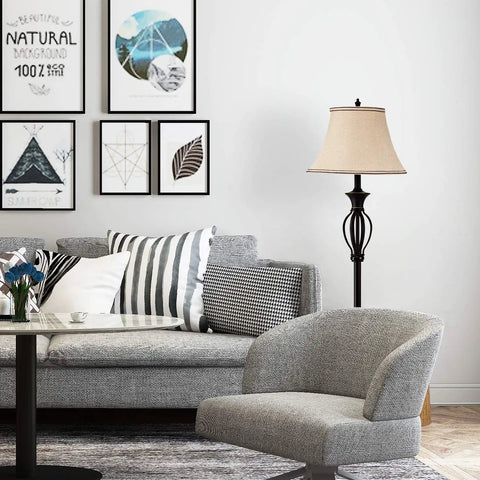 Living room with black metal floor lamp from Three Piece Rustic Farmhouse Lamp Set With Beige Linen Shades, Matching Scroll Design