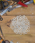Stainless Steel M8 Spring Lock Washers Set 100 Pieces Split Locking Washers For Screws And Bolts Pro Grade DIY Gear For Industrial And Home Use With Heavy Duty Security And Vibration Resistance, shown on workbench