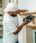 Person using Granat Profile Delta Sanding Pads Set Of 10 With Flexible Foam Backing For Curves And Corners on wooden surface