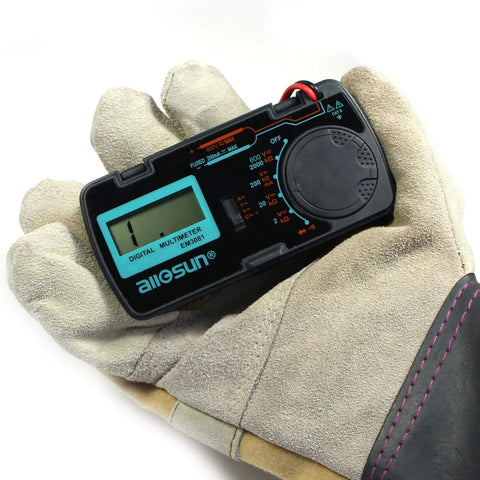 Gloved hand holding Pocket Size Digital Multimeter DMM Multi Tester For Amp Ohm Volt DC AC Voltage and Current Measurements
