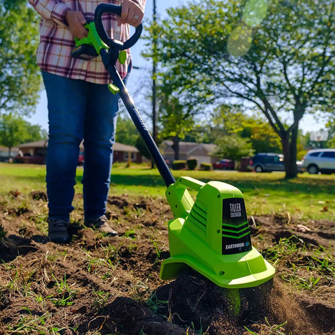 Person using 20V Cordless Garden Tiller Cultivator With 7.5 Inch Tilling Head, 2Ah Battery And Fast Charger Included, Green
