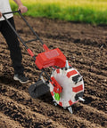 Hand Push Garden Seeder With Seven Nozzles For Precision Row Planting in use on freshly tilled soil, demonstrating adjustable depth and spacing.