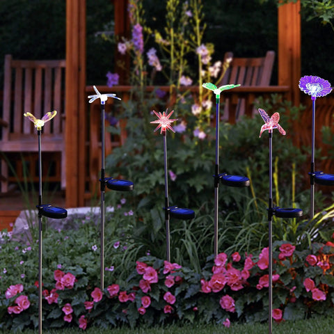 Six Pack Solar Garden Stake Lights Set With Color Changing LED Figurines Including Butterfly Dragonfly Hummingbird Bee Star Sunflower lit up
