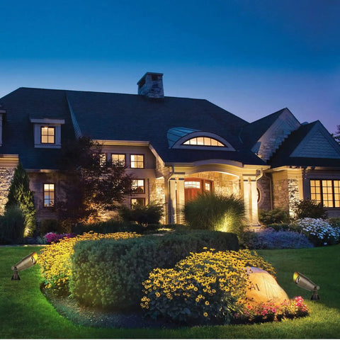 Brass Mini Landscape Light With 450 Lumen Output, 5W MR16 LED, 12V AC/DC, illuminating garden with warm 2700K glow