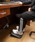 Person using Toasty Toes Foot Warmer And Ergonomic Heated Footrest With Three Adjustable Positions And Two Heat Settings Portable
