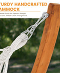 Close-up of Two Person Cotton Fabric Hammock With Spreader Bars And 10.5 Ft Wood Arc Stand showing handwoven knots on wooden stand.
