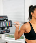 Straight Bar For Adjustable Dumbbells Converts Your Elite EXP Sets Into A Legit Barbell For Home Gym Workouts in use by woman