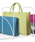 Heavy Duty White Shelf Dividers For Closet Organization And Linen Storage in use separating bags and towels on a shelf