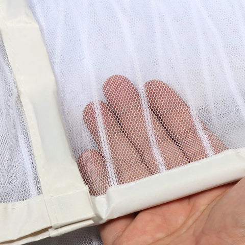 Hand touching white mesh of Upgraded Magnetic Screen Door With 36 Strong Magnets, Heavy Duty Mesh, Hands Free Entry For Pets, Fits Doors Up To 38x82 Inches, White, Quick Close And No Slam With Gravity Sticks.