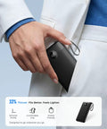 Hand holding the Total Game Changer Portable Charger With Four Built In Cables And Massive Twenty Thousand Mah Fast Charging Power Bank for easy storage.