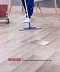 Dual Pop Up Floor Box Kit For Hardwood Carpet And Tile Floors With Watertight Gasket and a person mopping nearby