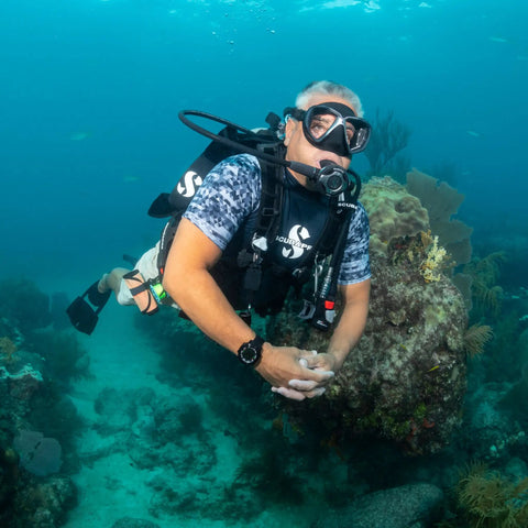 Diver using Air Balanced Flow-Through Piston Regulator With Chrome Brass Body DIN Connection in underwater scene
