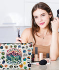 Woman using brushes with "Life is Better in the Mountains" hiking makeup bag, organizer for hikers and campers, toiletry pouch