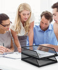 Twofer Pack Black Metal Letter Trays Set For Desk Organization on office desk during a team meeting, stackable wire mesh design