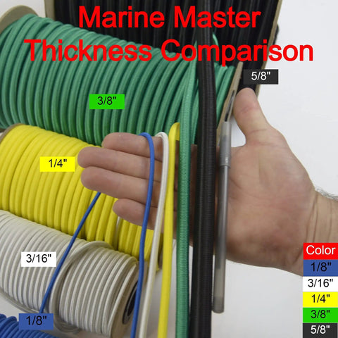 Hand holding 1/4 inch black bungee cord among other cords showing thickness comparison, highlighting marine-grade variety.