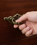 Hand pulling on Antique Brass Bail Drawer Pull from 6 Pack, Vintage Zinc Alloy Cabinet Handles With Screws, 6 Inch Total Length