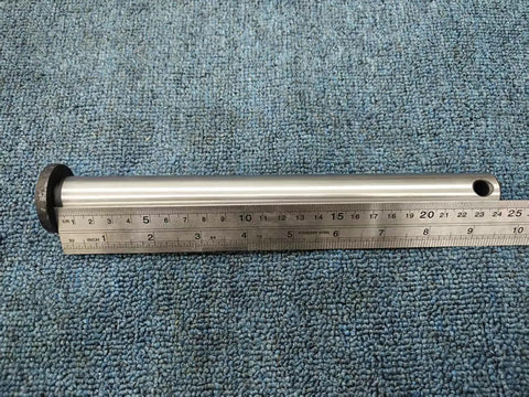 Top Notch 2-Piece Mini Excavator Bucket Pin Set Featuring 25mm Diameter By 250mm Length Replacement Pivot Pins laid on a ruler.