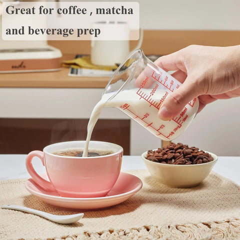 Borosilicate Glass Measuring Cup 1 Cup 8oz with Spout pouring milk into coffee with clear readouts visible