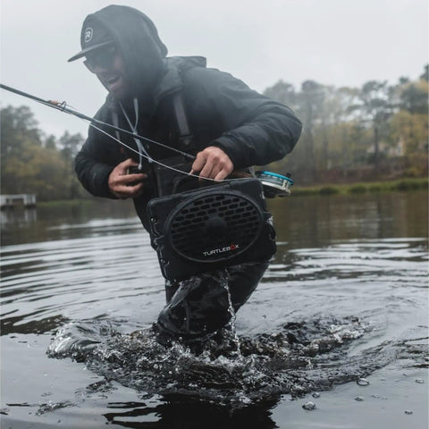 Rugged Portable Outdoor Bluetooth Speaker With Ultra Loud 120dB Sound, IP67 Waterproof And Dustproof, used by man wading in water