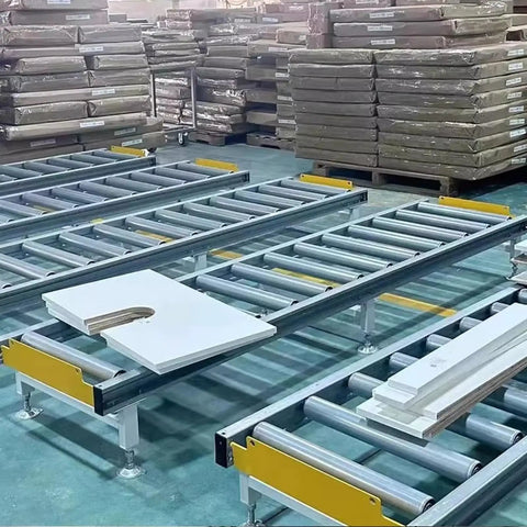 Super Heavy Duty Modular Conveyor Rollers And Connectable Discharge Chutes With Smooth Metal Roller Slide Kit For No Sweat Warehouse Dumping And Quick Truck Bed Unloading Rock Solid 5 Piece Pack Silver in a busy warehouse setting.