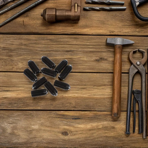 10PC Carbon Steel Ball Head Spring Plunger Grub Screws Featuring Knurled Caps And Load Bearing Springs on a wooden surface.