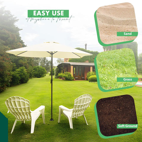 Heavy Duty Beach Umbrella Sand Anchor And Metal Stand For Outdoor Yard Garden, shown on grass with soft ground and sand.