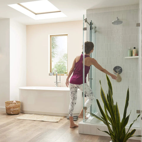 Modern bathroom with woman using Studio S Shower Trim Kit With One Piece Ceramic Cartridge And Double Ceramic Pressure Balance, Polished Chrome Finish Easy Install Keeps Water Temp Steady For A Smooth No Sweat Shower