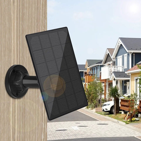 Rugged IP65 Waterproof Solar Panel Kit For Security Cameras With 10Ft Cable And Adjustable Mount on wooden wall outdoors