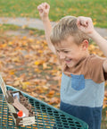 Child excitedly assembling DIY Wooden Knife Making Kit For Kids Teens And Adults - Real Wood Craft Gift on a table.