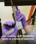 Hands using Scotch-Weld DP100 Clear Epoxy Adhesive 1.7 Oz Two-Part Bonding Glue For Metal Plastic Ceramic Surfaces with applicator