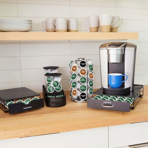 Slim Under-Counter Coffee Pod Drawer For 24 K-Cups shown holding pods under a coffee maker on a kitchen counter