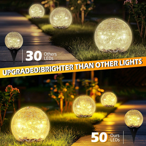 Outdoor Solar Globe Lights With 50 LED Crackled Glass Orbs Waterproof No Wiring Ground Lights illuminating a garden path.