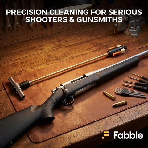 Remington Model 700 Field Cleaning Kit With Quick Action Brush And Tough As Nails Steel Bolt Opener Including Five No Nonsense Replacement Swabs For Gritty Raceway Lugs And Snappy Firing Pin Service on a wooden bench.