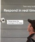 Man interacting with Outdoor Security Camera Starter Bundle With Base Station And One Camera 1080P HD Wire Free Night Vision