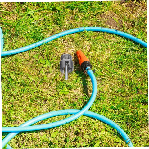 Ciieeo 3 Piece Pipe Threader Kit For Pvc Plumbing on grass with attached blue hose for DIY plumbing projects.
