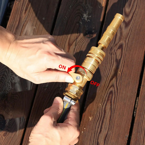 Person operating Brass Garden Hose Quick Connect Set With Shutoff Valve, Three Quarter Inch Fittings, on a deck