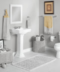 Bathroom with Mason Chrome Tissue Paper Holder Roller Only With Pro Fit Installation System near a pedestal sink and toilet.