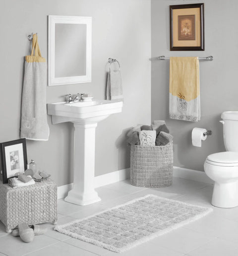 Bathroom with Mason Chrome Tissue Paper Holder Roller Only With Pro Fit Installation System near a pedestal sink and toilet.