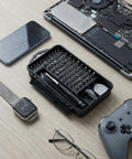 All-In-One 115-In-1 Precision Screwdriver Set With 100 Bits And Opening Tools For Phones, Macs, Computers, Watches, Consoles, displayed on table