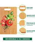 Close-up of Bamboo Cutting Board Set of 3 for Kitchen with tomatoes and basil, featuring wide handle and smooth surface.