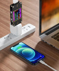 2 In 1 Digital USB Tester Meter with Type C Connector measuring charging speed on smartphone and laptop setup.