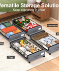 Under Bed Storage With Wheels 2 Pack 48L Lidded Rolling Bins For Shoes And Clothes Grey Narrow Metal Drawers Easy Pull Out Design Fits Dorm Rooms And Closets Space Saving 30.7 X 16.9 X 6.69 Inches showing organized storage for clothing, shoes, toys, and decorations under a bed in a bedroom.